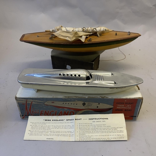 115 - A model speedboat ‘Miss England’ with a methylated spirits engine, boxed, along with an Ailsa Pond Y... 