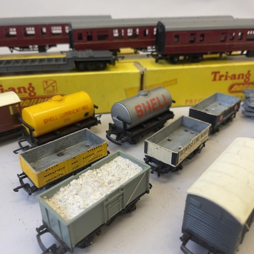 116 - A collection of Tri-ang TT Gauge carriages and rolling stock, including two T82 Mainline Composite C... 