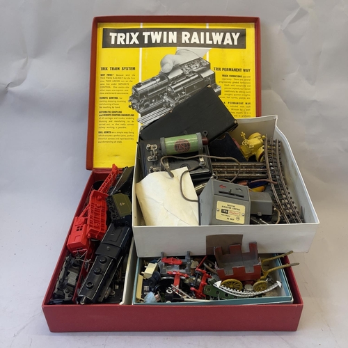 124 - Three boxes of Tri-ang 00 gauge spares and accessories, including two locomotives, die cast figures,... 