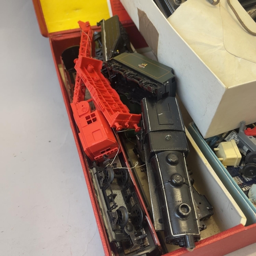 124 - Three boxes of Tri-ang 00 gauge spares and accessories, including two locomotives, die cast figures,... 