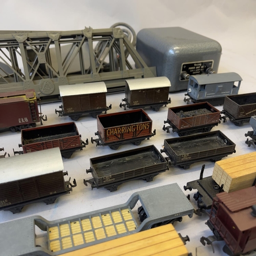 125 - A collection of Trix Twin and Tri-ang 00 Gauge locomotives and rolling stock including a 63950 0-4-0... 