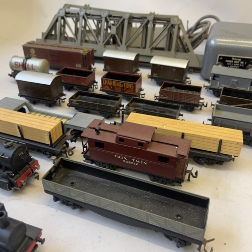 125 - A collection of Trix Twin and Tri-ang 00 Gauge locomotives and rolling stock including a 63950 0-4-0... 