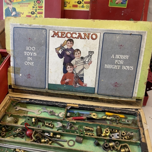 128 - A collection of early Meccano sets, including 6, 6a, 7a and 8a, along with a much earlier layered bo... 