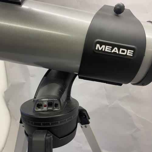 132 - A Meade Instruments motorised reflector telescope on tripod. Untested.