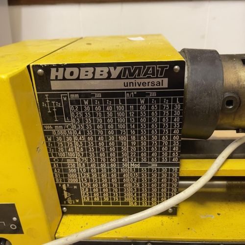 133 - A Hobbymat lathe and pillar drill, along with a box of tools and accessories.