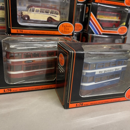 55 - A collection of 17 Exclusive First Editions die cast models of buses, coaches and trams all carrying... 