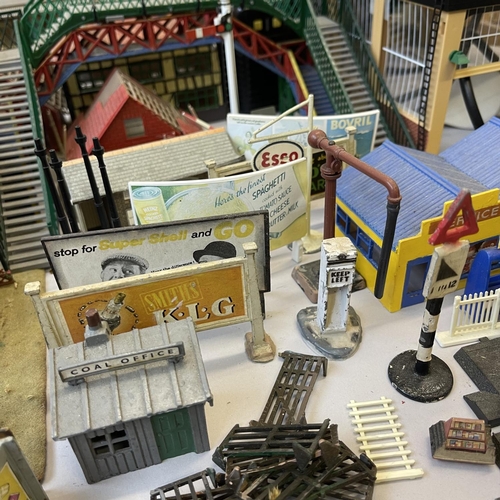 6 - An extensive collection of 00 gauge plastic, card and cast-metal trackside buildings and accessories... 