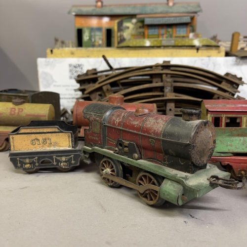 8 - A collection of Hornby Series tin plate locomotives and rolling stock, including two steam trains (o... 