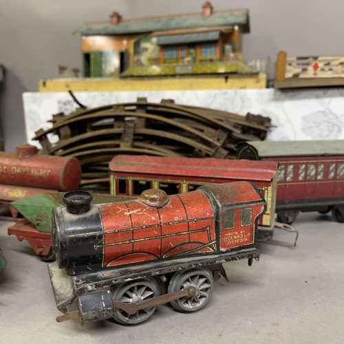 8 - A collection of Hornby Series tin plate locomotives and rolling stock, including two steam trains (o... 