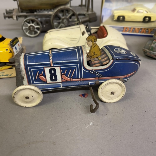 74 - A collection of tin plate clockwork cars and others, including a Gutmann of Paris Memo 708 racing ca... 