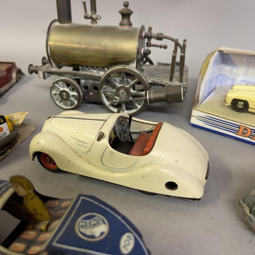 74 - A collection of tin plate clockwork cars and others, including a Gutmann of Paris Memo 708 racing ca... 