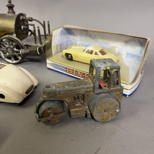 74 - A collection of tin plate clockwork cars and others, including a Gutmann of Paris Memo 708 racing ca... 