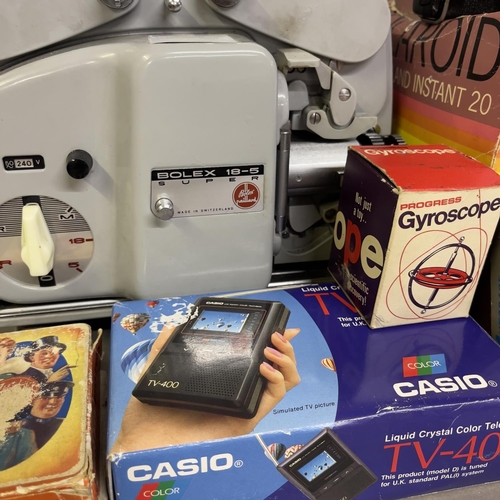 75 - A Paillard Bolex Super 8 projector, along with a Nintendo Game and Watch Chef, a Casio Autorace, A C... 