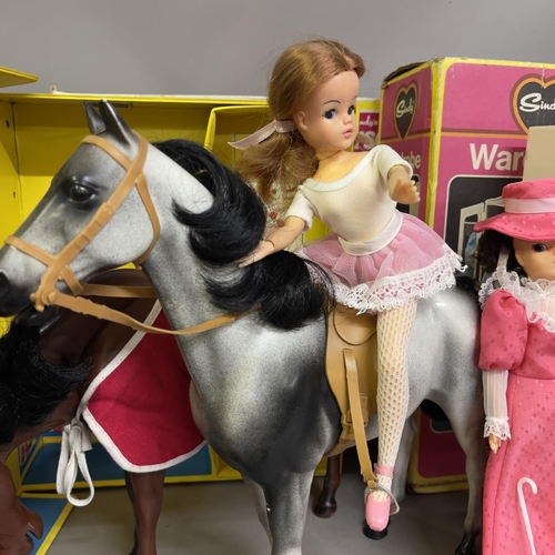 82 - A Sindy Horse (boxed), three Sindy Dolls, a Sindy Wardrobe (boxed), a Sindy Apartment Carry Case and... 