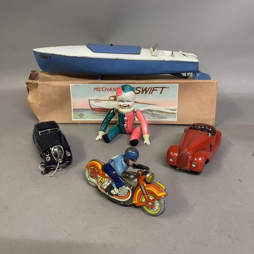 85 - An AM Metta Russian tin plate clockwork motorcycle racer, a Schuco Kommando Anno 2000 clockwork car ... 