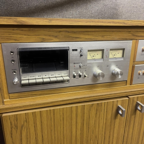 20 - A vintage 1970s hifi system in a custom built cabinet, comprising a Metrosound Plus ST20 Amplifier, ... 