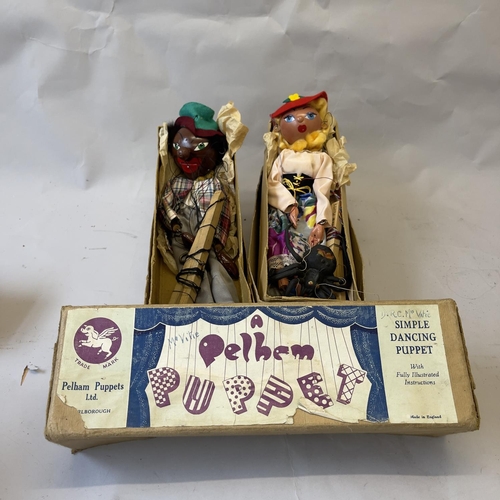 89 - An early pair of boxed Pelham Puppets comprising of The Minstrel and Mitzi, along with a spider.