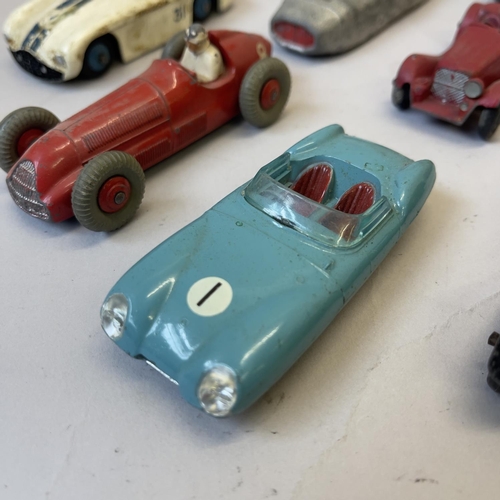 95 - A collection of die cast cars, including a Dinky Cunningham C5R, a Dinky Thunderbolt, A Dinky Speed ... 