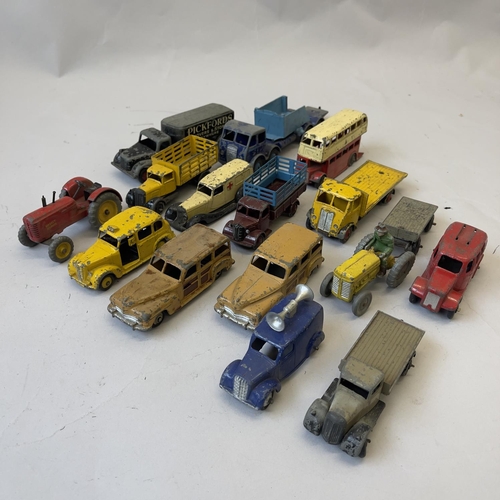 99 - A collection of early Dinky Die Cast models including 27F Estate Car, Loudspeaker Van, Austin Taxi, ... 