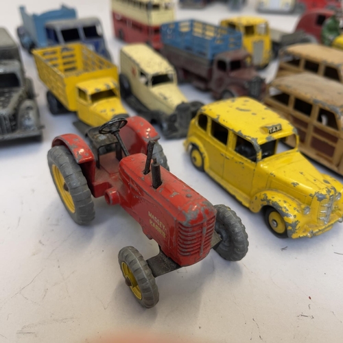 99 - A collection of early Dinky Die Cast models including 27F Estate Car, Loudspeaker Van, Austin Taxi, ... 