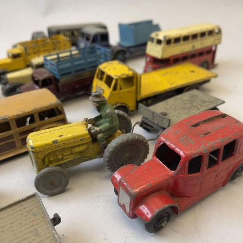 99 - A collection of early Dinky Die Cast models including 27F Estate Car, Loudspeaker Van, Austin Taxi, ... 