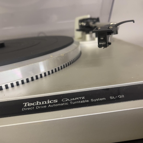 11 - A Technics SLQ2 Direct Drive turntable, with stroboscope. Boxed.