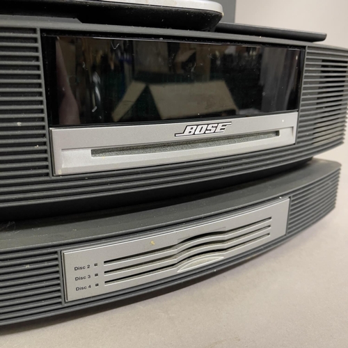 13 - A Bose Wave music system comprising Wave Radio with CD player, CD changer unit and DAB module. Inclu... 