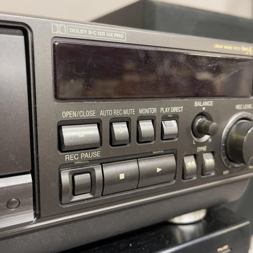 24 - A 1980s vintage hifi component system comprising of a Rotel RA-820BX amplifier, a Denon TU-710 tuner... 