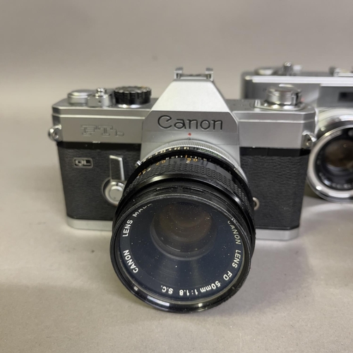 31 - A Canon AE-1 with 50mm F1.8 lens, a Canon FTb with 50mm F1.8 lens and a Minolta Hi-Matic 7S with 45m... 