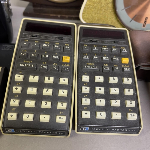 34 - A collection of early LED calculators, including two Hewlett Packard 22 finance calculators with man... 