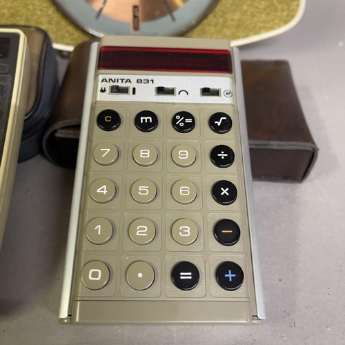 34 - A collection of early LED calculators, including two Hewlett Packard 22 finance calculators with man... 