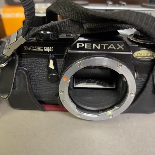 46 - A Pentax ME Super manual SLR camera along with a Tamron 35-70mm lens, a Hanimex 75-300mm lens, an Il... 