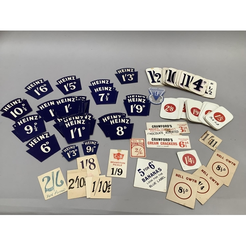 286 - A collection of vintage grocer's price tickets printed in blue, others applied with a red label toge... 