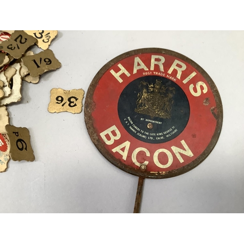 284 - A vintage grocer's metal flag printed in red, white and blue with Harris Bacon, together with a quan... 