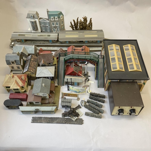 6 - An extensive collection of 00 gauge plastic, card and cast-metal trackside buildings and accessories... 