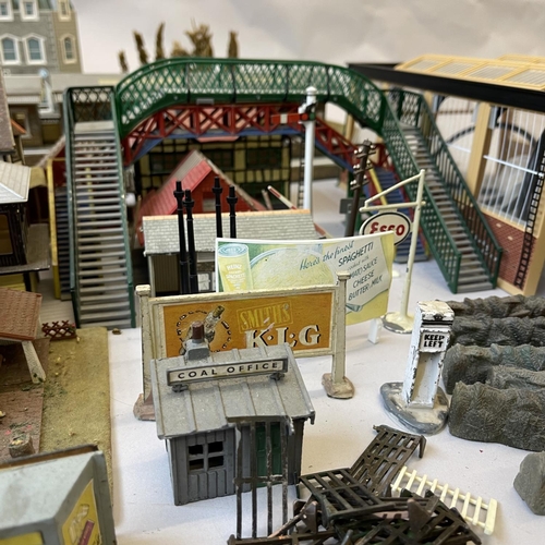 6 - An extensive collection of 00 gauge plastic, card and cast-metal trackside buildings and accessories... 