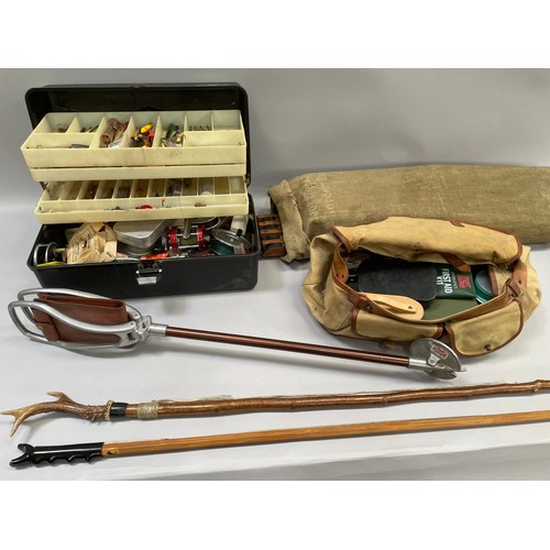 236B - A canvas and leather trimmed bag and a plastic box of fishing flies, lures, line, two spools, variou... 