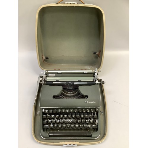 295B - Olympia De Luxe portable typewriter in carry case