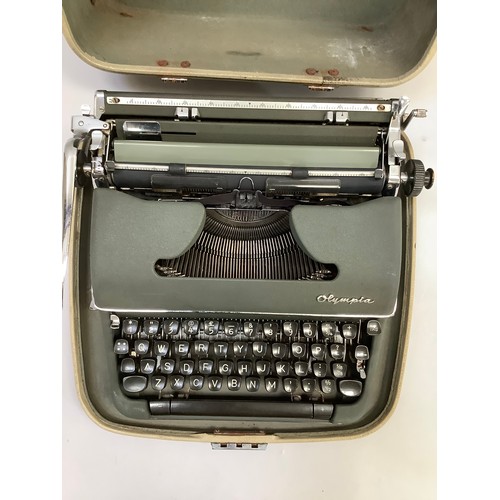 295B - Olympia De Luxe portable typewriter in carry case