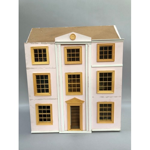 78 - Pink double fronted Georgian style dolls house with various items of furniture including bedroom sui... 