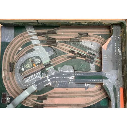 00 gauge table top model railway track layout with junctions built up at one side with industrial