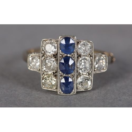 184 - AN ART DECO SAPPHIRE AND DIAMOND CLUSTER RING in platinum set to the centre with three oval faceted ... 