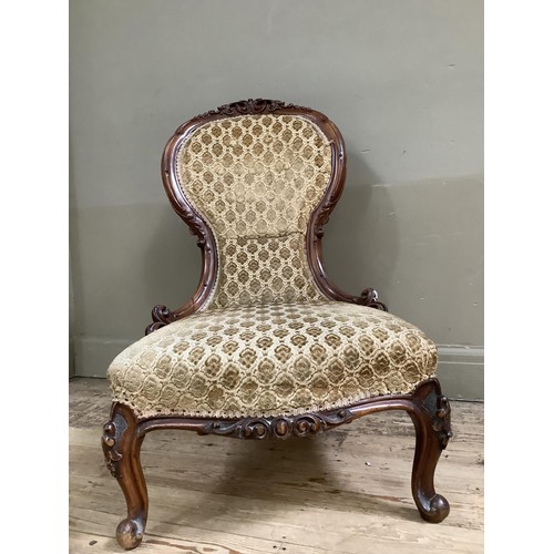 185 - 19th century mahogany nursing chair with carved foliate crest and frame on cabriole legs upholstered... 