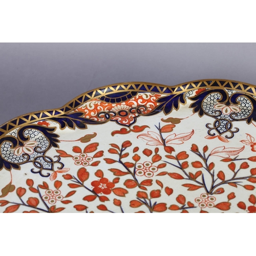 104 - A DERBY CROWN PORCELAIN CO LARGE TAZZA, of petal shaped circular form decorated in Imari palette wit... 