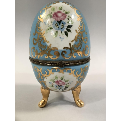 106 - A PAIR OF FRENCH PORCELAIN CASKETS, ovoid decorated in the Sevres style, with floral and gilt cartou... 