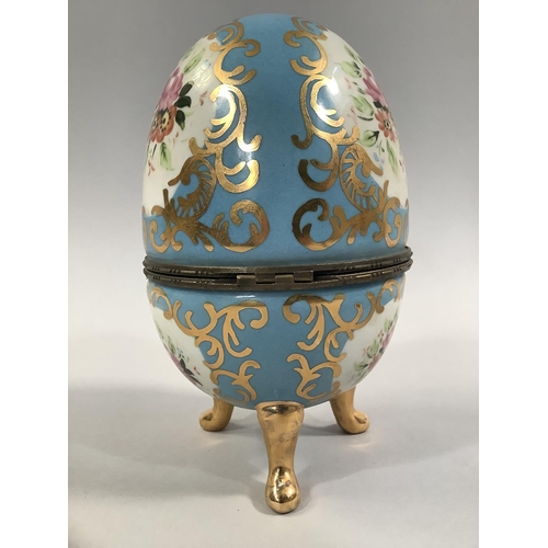 106 - A PAIR OF FRENCH PORCELAIN CASKETS, ovoid decorated in the Sevres style, with floral and gilt cartou... 