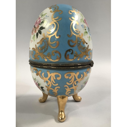 106 - A PAIR OF FRENCH PORCELAIN CASKETS, ovoid decorated in the Sevres style, with floral and gilt cartou... 