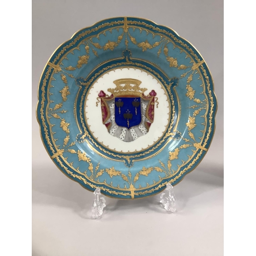 107 - A PAIR 19TH CENTURY SEVRES PORCELAIN CABINET PLATES central armorial motif, bordered with blue celes... 