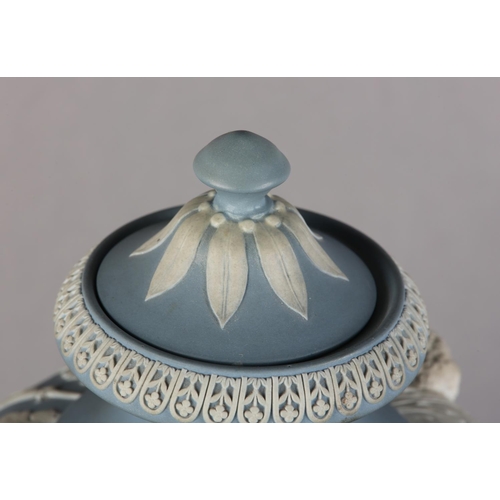 108 - A LARGE EARLY 19TH CENTURY WEDGWOOD JASPERWARE URN AND COVER, the pale blue body ornamented in white... 