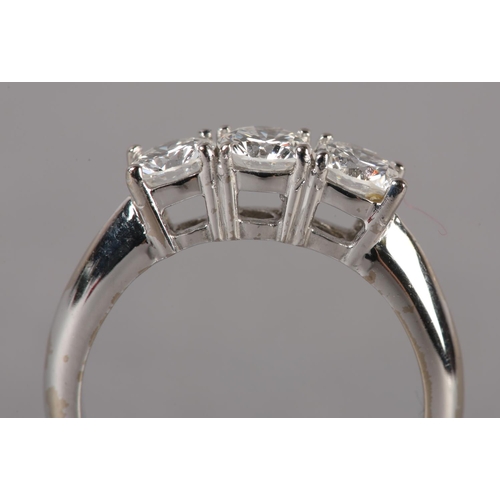 172 - A THREE STONE DIAMOND RING in 18ct white gold, the brilliant cut stones claw set in line, approximat... 